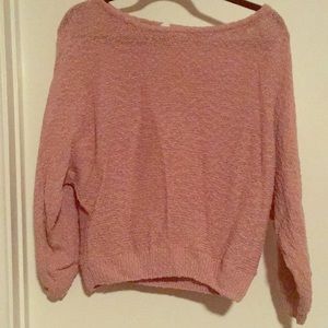 A pink Me to We sweater